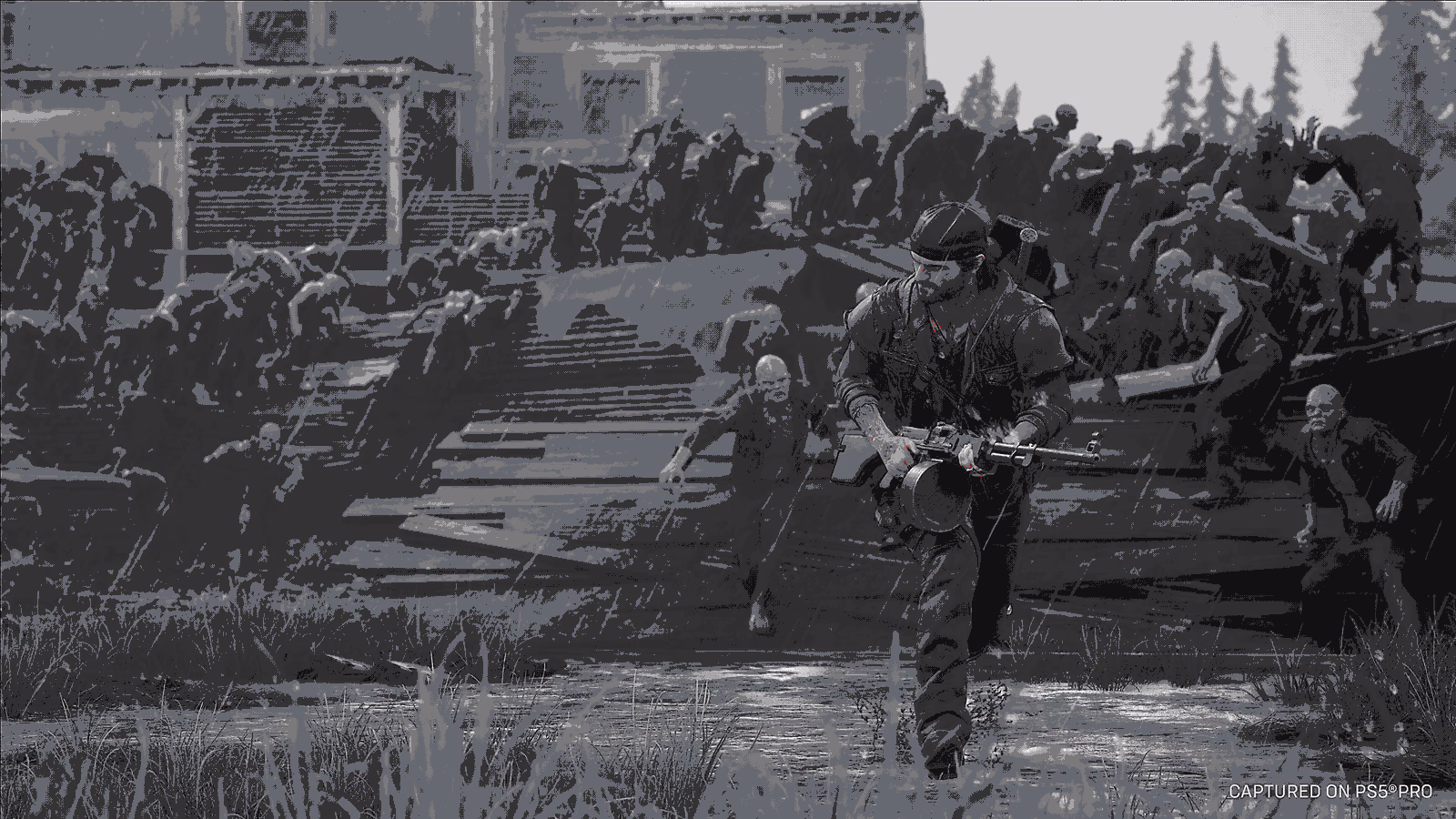 Deacon firing a machine gun while fleeing a large Freaker horde in Days Gone