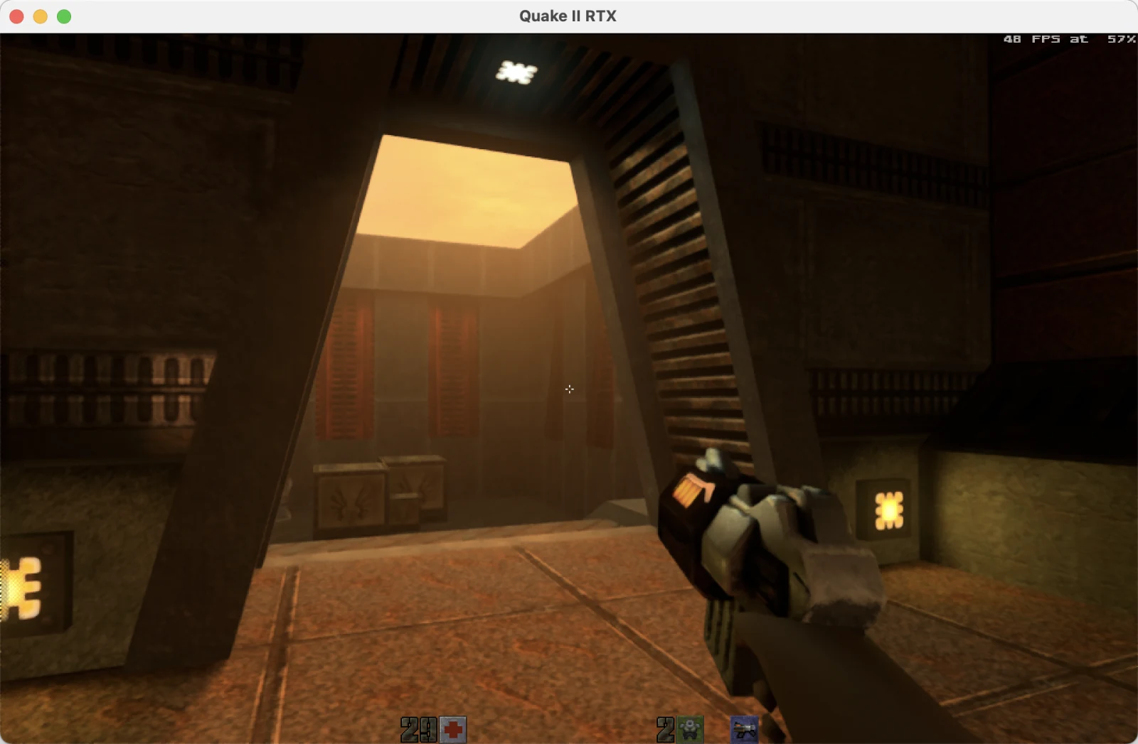 Quake II RTX showing warm volumetric god rays beneath a bright opening during the Apple M4 shader-override test.