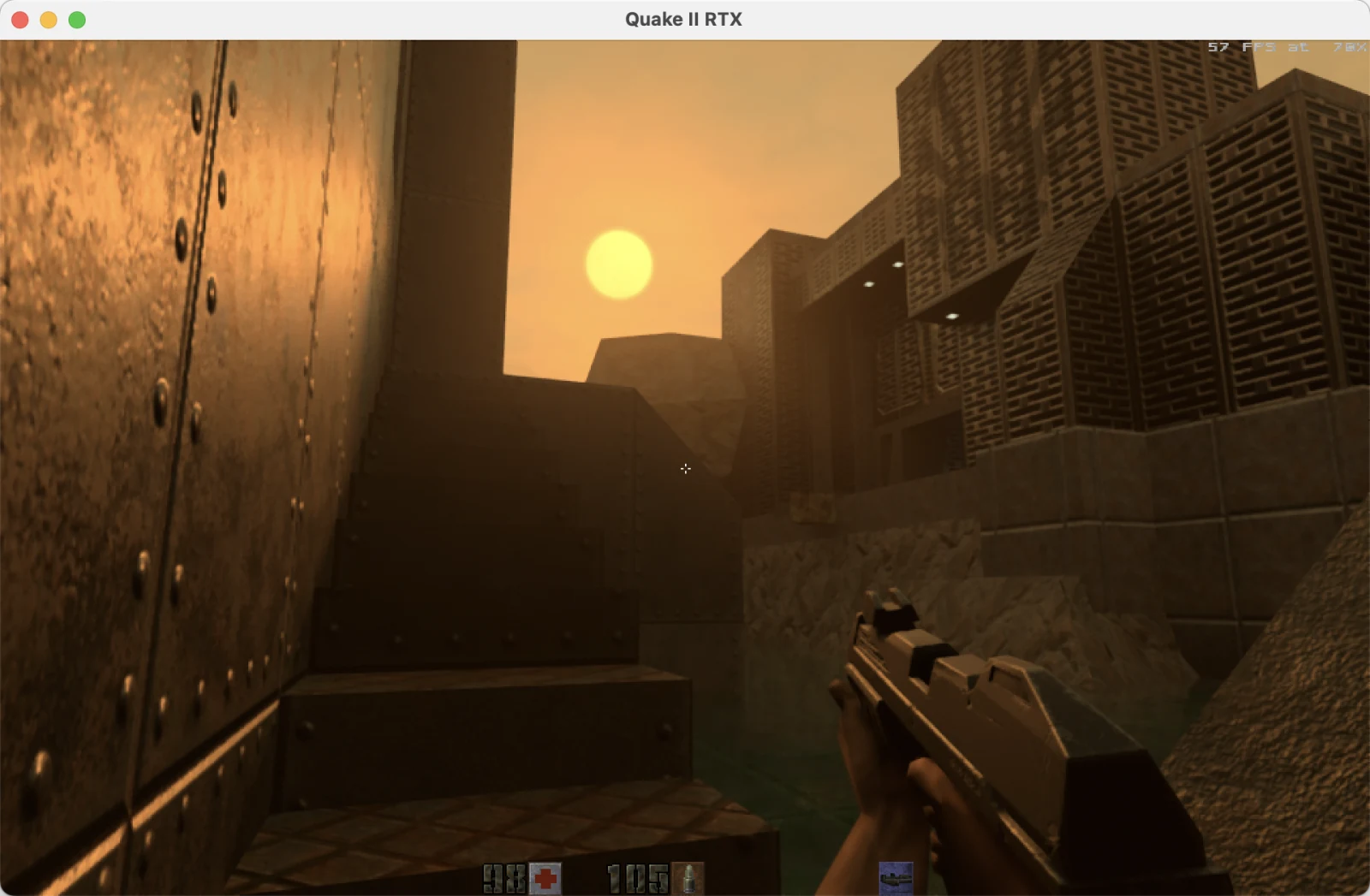 Quake II RTX rendering an outdoor industrial scene beneath a low sun with the patched god-ray pass active on Apple M4.